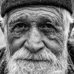 grayscale photo of an elderly man