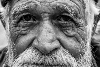 grayscale photo of an elderly man