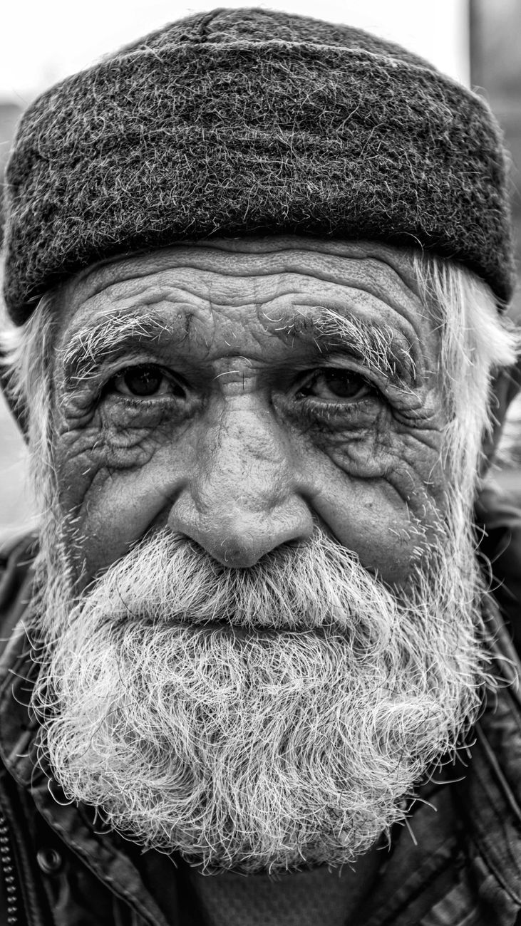 grayscale photo of an elderly man