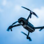 photo of gray quadcopter on the sky
